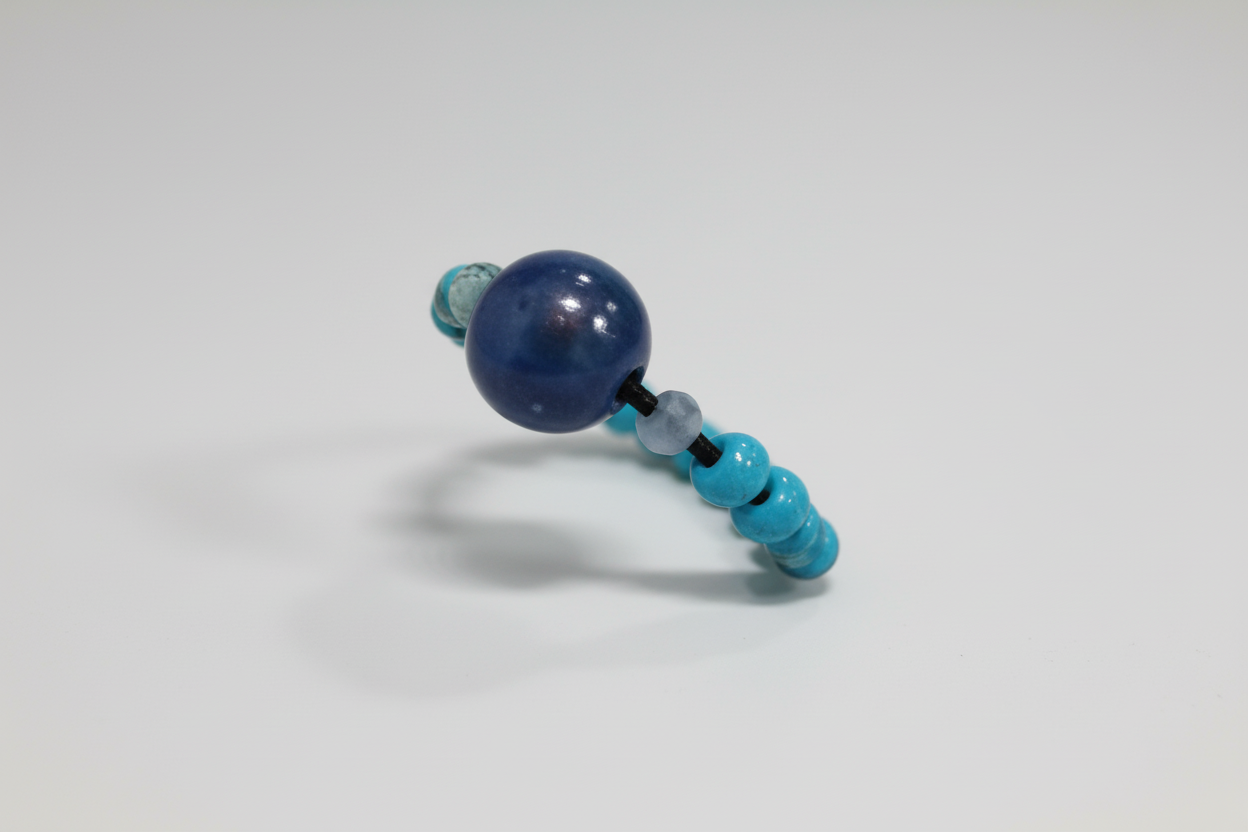 Anillo elástico con bola azul elástico IVA incluido