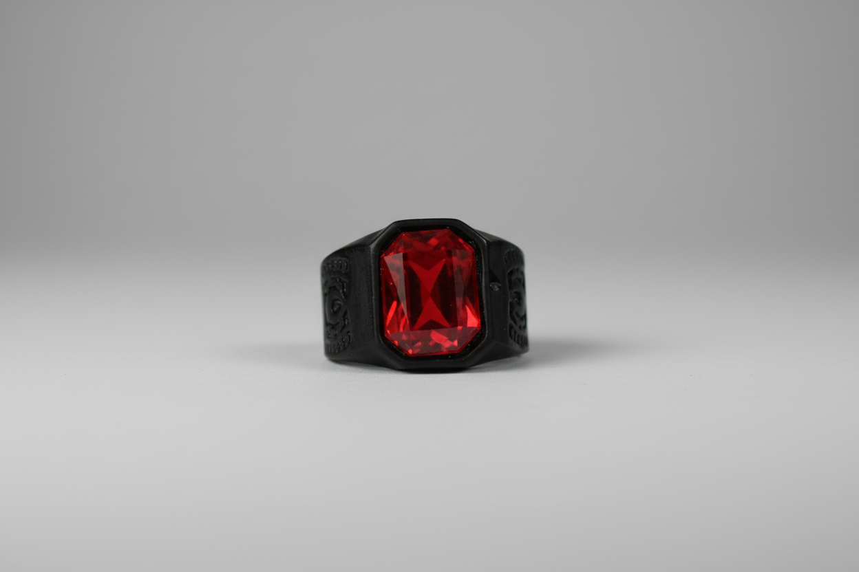 Anillo acero de color negro y piedra roja IVA incluido