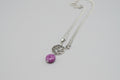 Colgante media luna con trisquel y piedra sugilita de acero con cadena( Diseño de Lubelia )Precio con IVA