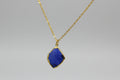 Colgante cadena acero dorada con concha azul