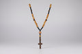 Rosario cuentas de madera y cruz de  madera, con ojo de tigre(Diseño de Lubelia) IVA incluido