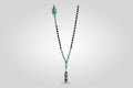 Collar de cuentas turquesa y turmalina con buda en el latera, y central, pluma acero( Diseño de Lubelia) IVA incluido