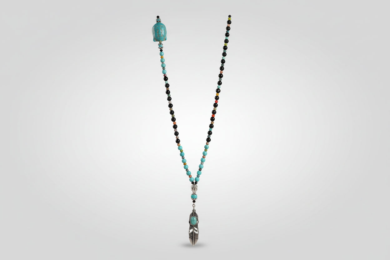 Collar de cuentas turquesa y turmalina con buda en el latera, y central, pluma acero( Diseño de Lubelia) IVA incluido