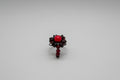 Anillo elástico flor piedras granate con cristales rojos y bola sintética roja (Diseño de Lubelia) IVA incluido