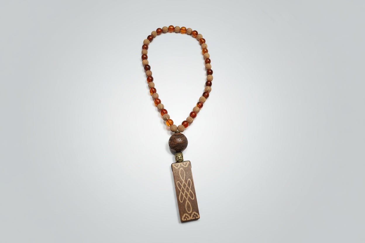 Japamala de 45 cuentas de color ambar y nudo de bruja de madera ( Diseño de Lubelia) IVA incluido