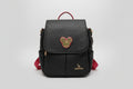 Bolso Mochila negra con pieza metálica del persoje de dibujos  Mikey, correas en color rojo. IVA incluido