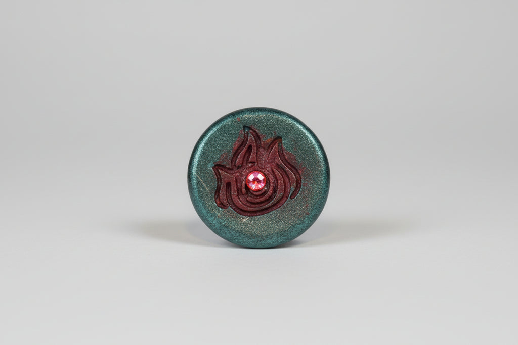 Botecito granate con símbolo elemento fuego. 12X5cm. Hecho por Lubelia ) IVA incluido: