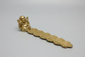 Porta incienso dorado figura Buda 20X4 CM. IVA incluido.