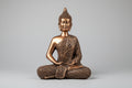 Buda Shakyamuni en meditación de madera acabado efecto metálico bronce.28X19cm. IVA incluido