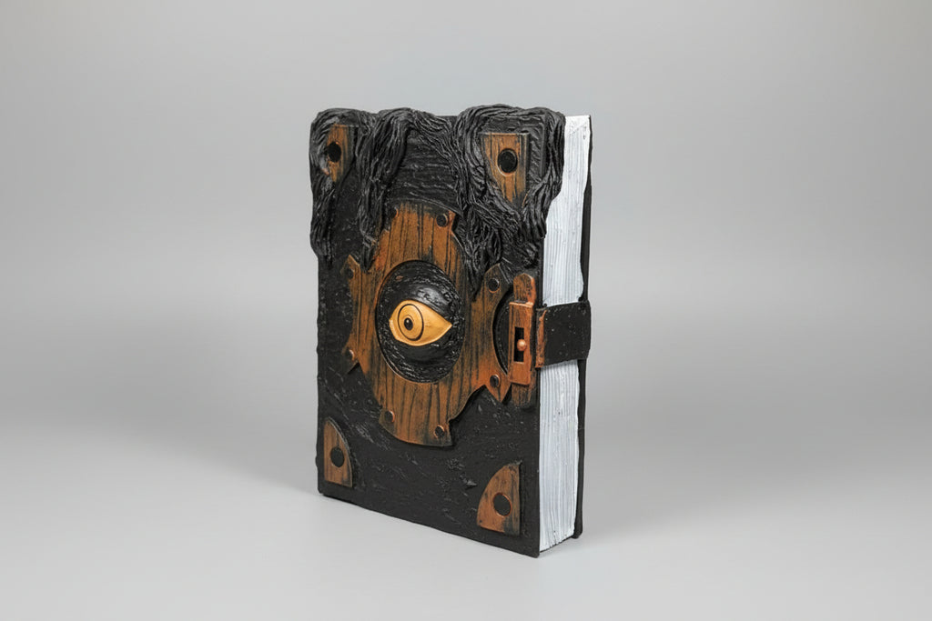Reposa libros en forma de libro  mágico con ojo 18X4 cm. IVA incluido