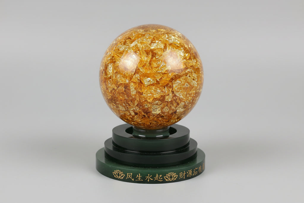 Bola de cristal gioratoria con pan de oro 11X9 cm. IVA incluido.