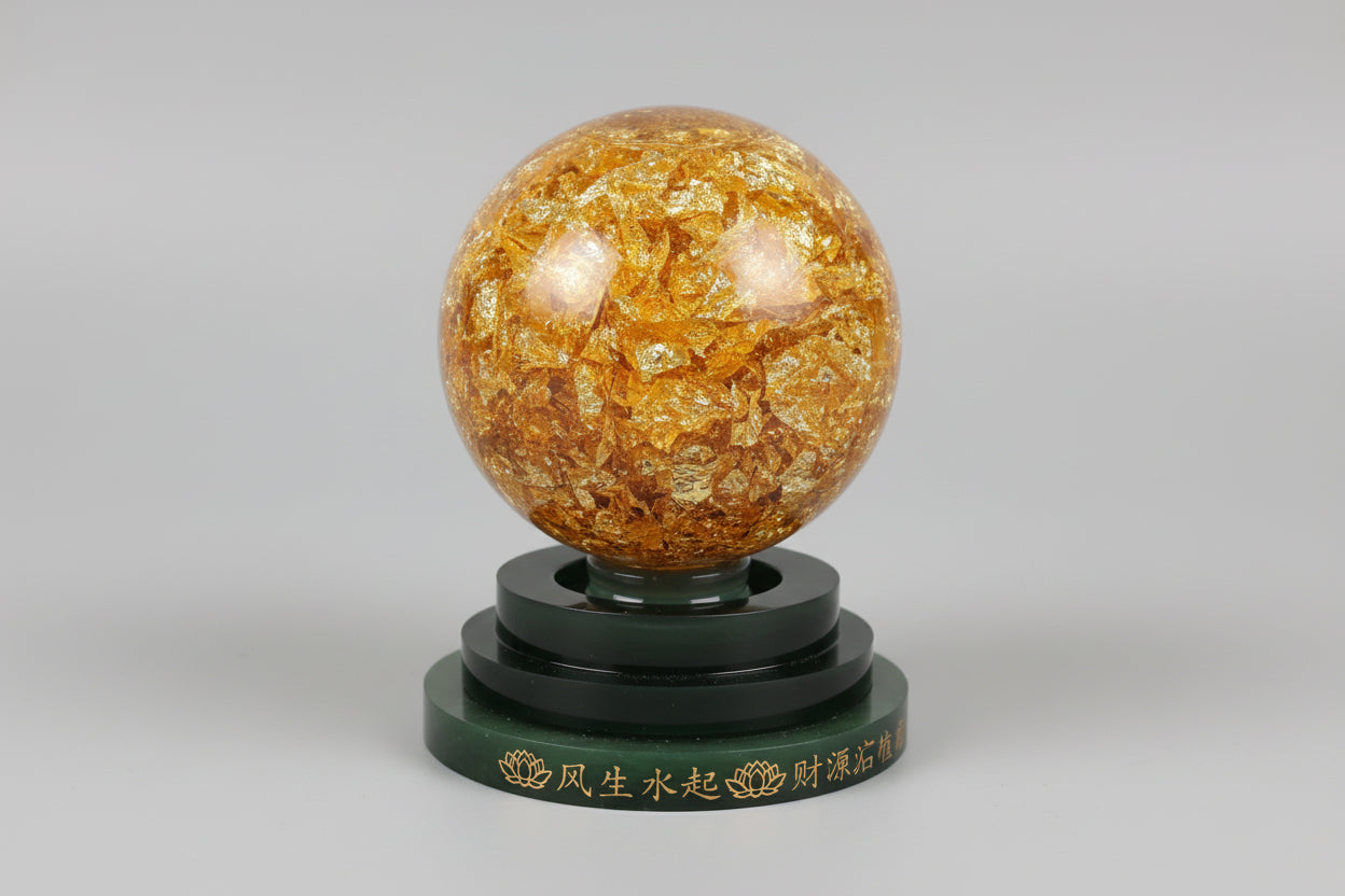 Bola de cristal gioratoria con pan de oro 11X9 cm. IVA incluido.