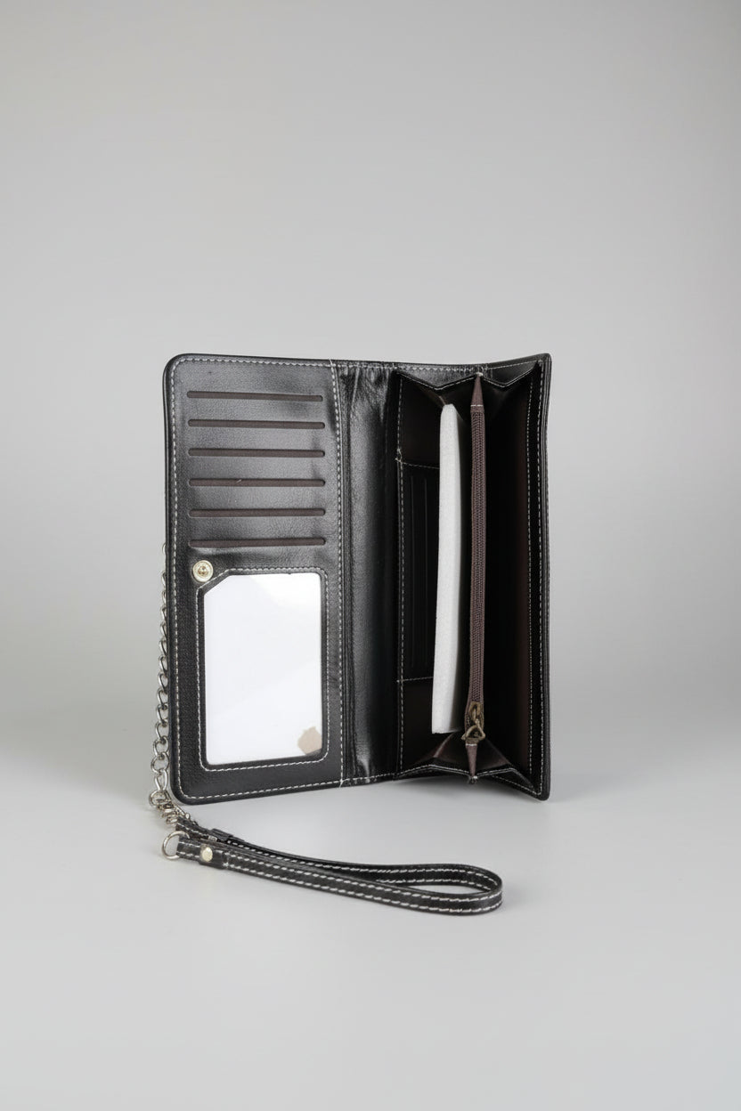 Monedero bruja, color negro. 20X11 cm. IVA incluido.