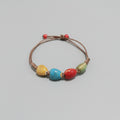 Pulsera de cuerda con cuentas de colores. IVA incluido