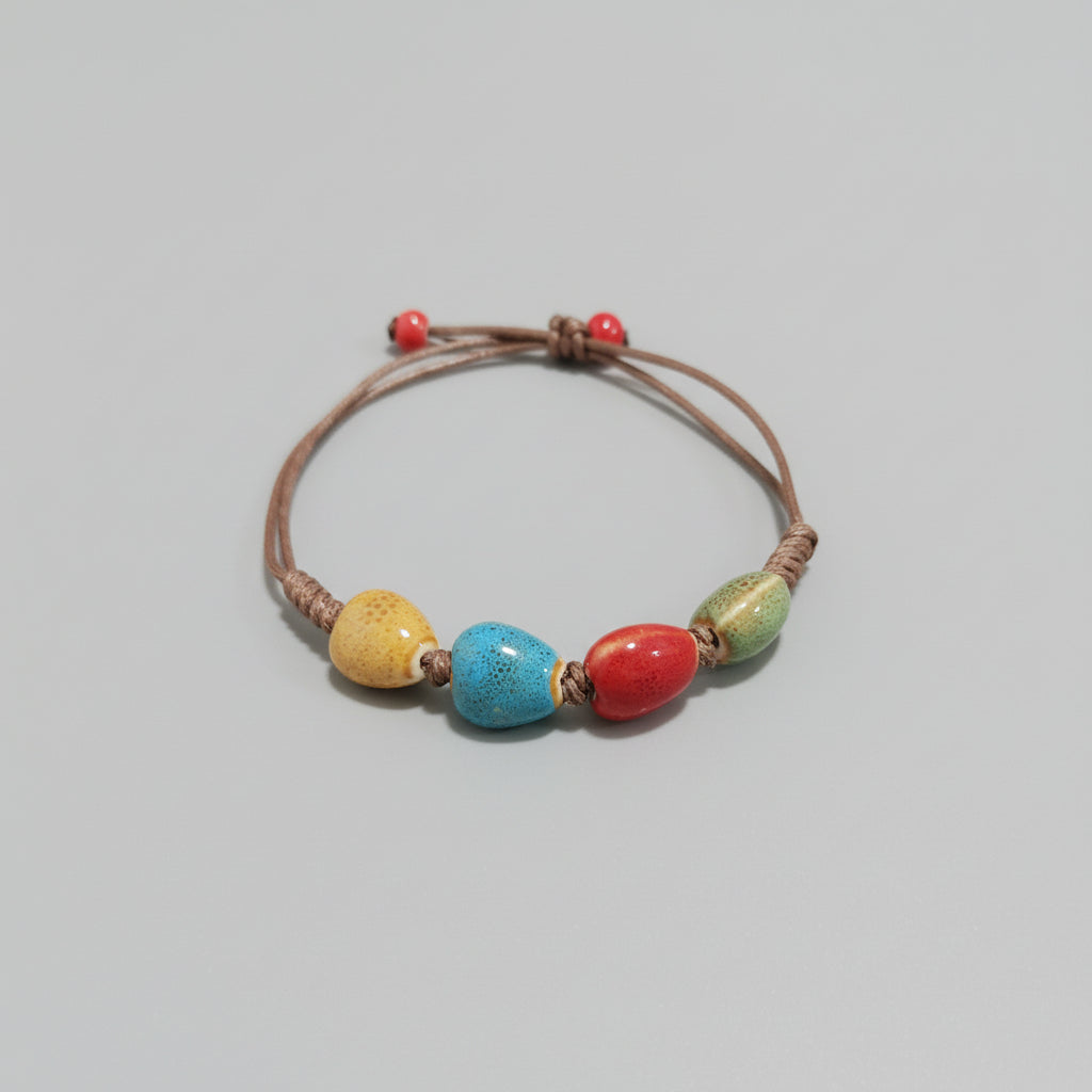 Pulsera de cuerda con cuentas de colores. IVA incluido