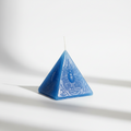 Vela pirámide con grabado, ojo color azul 7X6 cm. IVA incluido