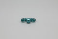 Anillo elástico con bola azul  y critales verdes IVA incluido