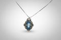 Colgante pìedra azul engarzado con flores acero con cadena iva incluido