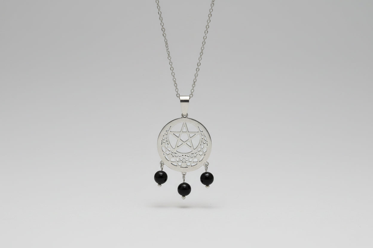 colgante tetragramatón dentro de una media luna acero  y tres turmalinas pequeñas