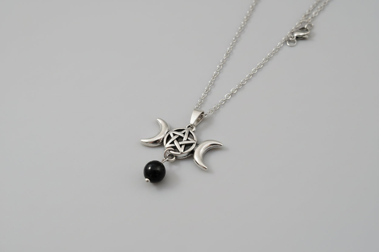 Colgante triple luna  con tetragramatón acero y obsidiana (Diseño de Lubelia ) Precio con IVA