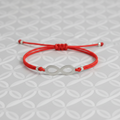 Pulsera elástica roja amuleto infinito acero. IVA incluidol