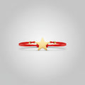 Pulsera elástica roja amuleto estrella acero  dorada. IVA incluido