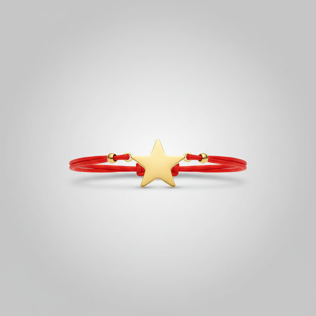 Pulsera elástica roja amuleto estrella acero  dorada. IVA incluido