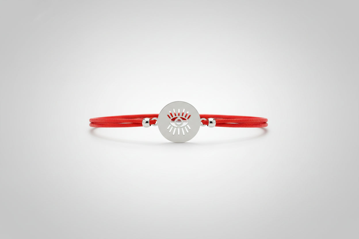 Pulsera elástica roja amuleto ojo acero. IVA incluido