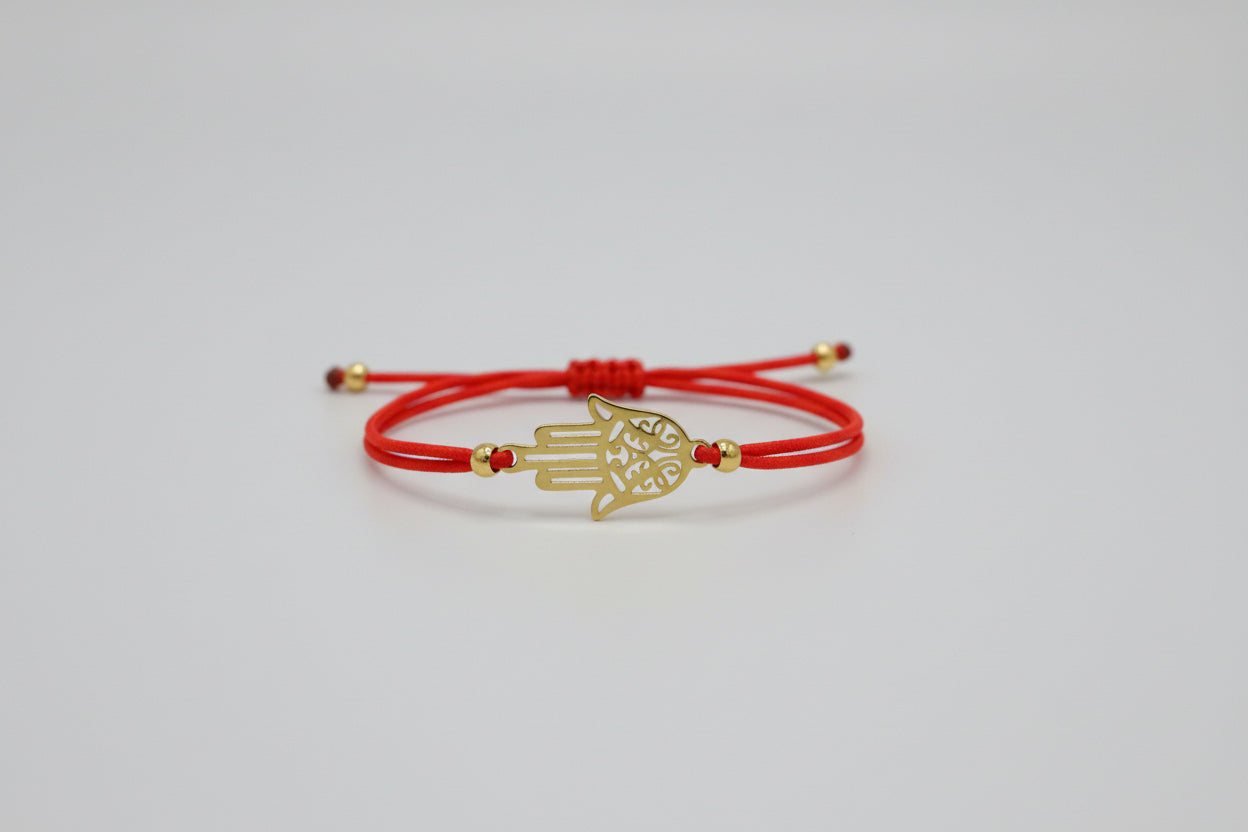 Pulsera elástica roja amuleto mano de Fátima acero dorada. IV A incluido